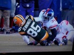 C. You can see the shin contacting the ground before the knee, but the ball is obscured.