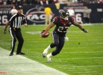 Line judge Gary Arthur has his eyes on the feet of Texans running back Arian Foster. (Houston Texans photo)