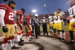 Referee Jerome Boger shows the coin to the Packers captains. (San Francisco 49ers photo)
