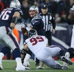 Umpire Garth DeFelice watches the line as it closes in on Patriots quarterback Tom Brady (David Silverman/New Engalnd Patriots)