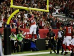 Tony watches Tony. Falcons tight end Tony Gonzelez celebrates a touchdown while back judge Tony Steratore makes sure there is not an excessive celebration foul. (Jimmy Cribb/Atlanta Falcons)