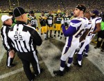 Referee Scott Green and back judge Scott Helverson preside over the coin toss. (Jim Biever/Green Bay Packers)