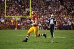 Referee Pete Morelli trails the play on a reception by Redskins tight end Logan Paulsen (Ned Dishman/Washington Redskins)