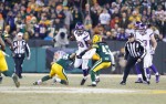 Umpire Bruce Stritesky (108) watches the defensive line as they meet Vikings running back Adrian Peterson. (Minnesota Vikings photo)