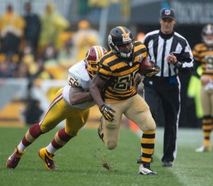Head linesman Dana McKenzie watches a run by Steelers running back Baron Batch in a game against the Redskins. During the game McKenzie ejected Redskins safety DeAngelo Hall in a heated confrontation.