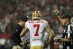 Line judge Tom Stephan indicates a timeout is ending to 49ers quarterback Colin Kaepernick and coach Jim Harbaugh. (San Francisco 49ers photo)
