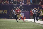 Head linesman Steve Stelljes gives chase after a catch by 49ers receiver Michael Crabtree. (San Francisco 49ers photo)