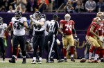 Umpire Darrell Jenkins gets ready to spot the ball after a sack by Ravens linebacker Paul Kruger. (Perry Knotts/NFL)