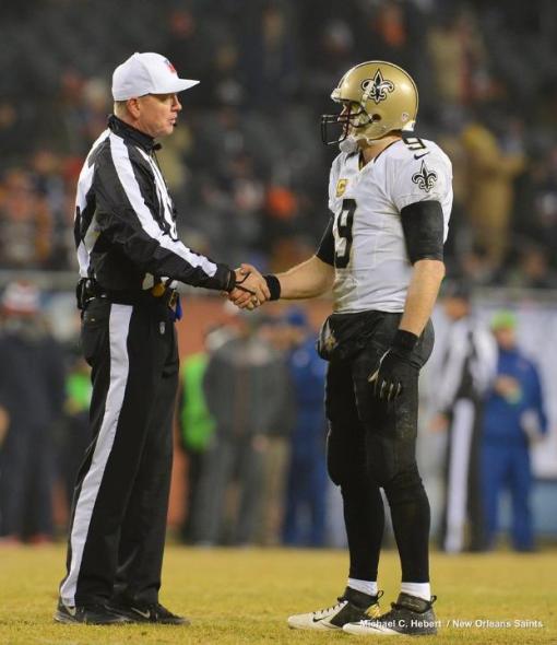 Referee Carl Cheffers greets Drew Brees (New Orleans Saints photo)