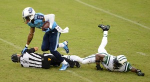 Billy Smith during a collision with Titans receiver Nate Washington [Donn Jones/Tennessee Titans]